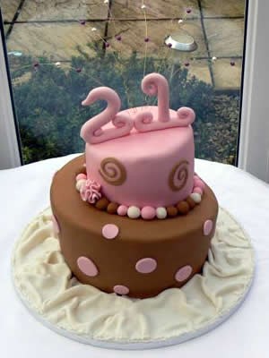 Pink and brown topsy turvey 21st cake